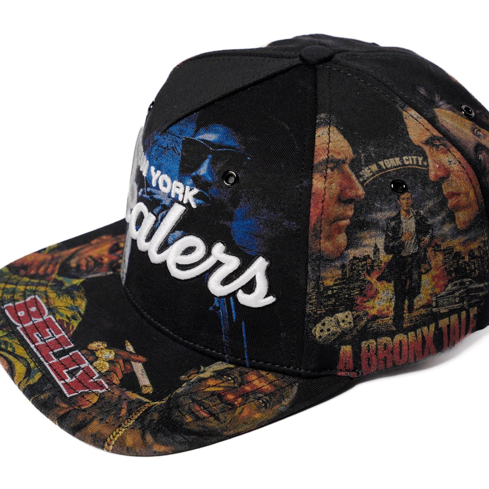 The Classics NY movie-collage snapback, flat brim — front angle with brim print