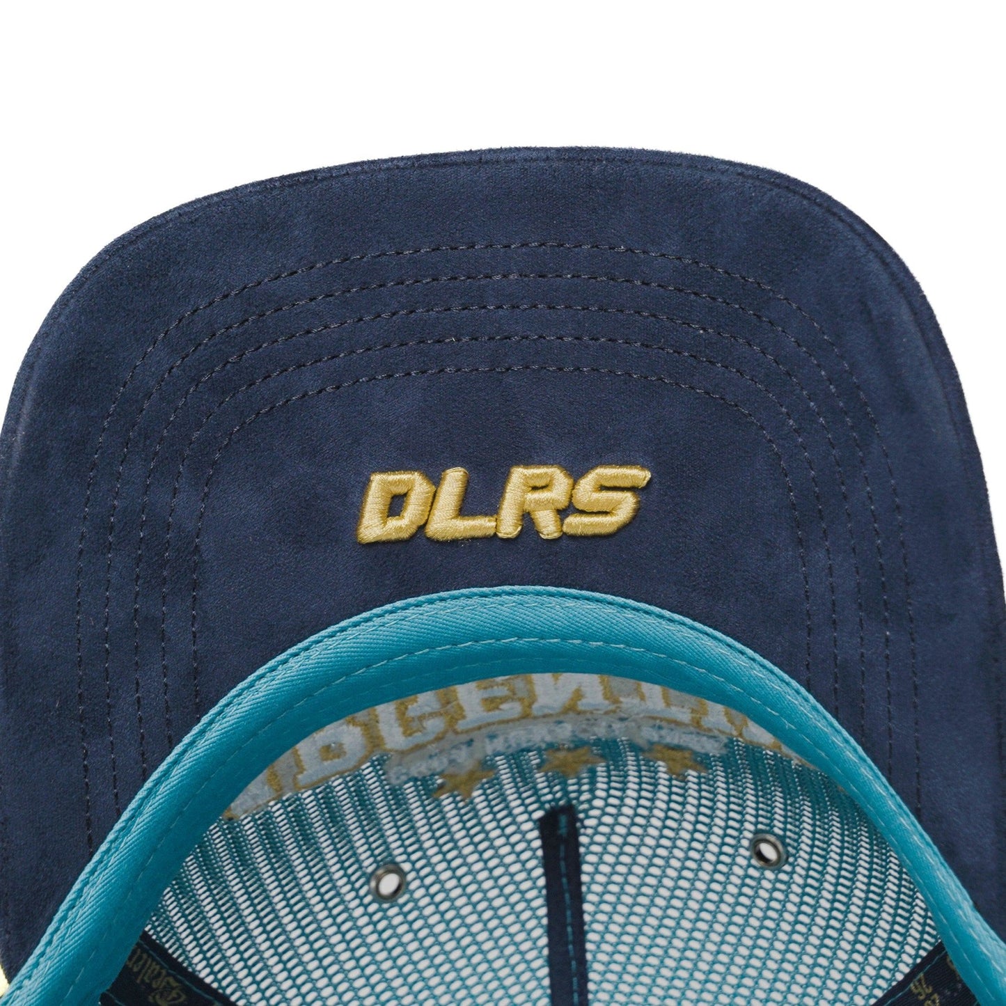 Underbrim detail of Argentina trucker hat with navy suede and gold DLRS embroidery — The Hat Dealers