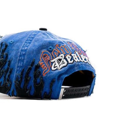 Blue distressed denim snapback hat with flame embroidery and bold embroidered lettering
