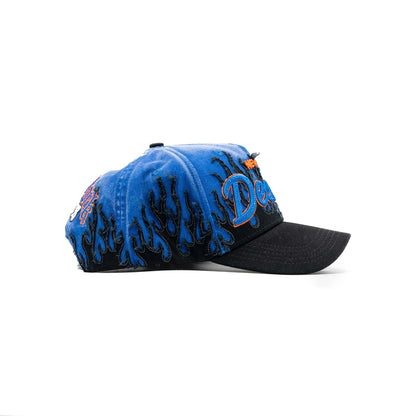 Blue and black flame embroidered cap with curved brim and bold orange detailing