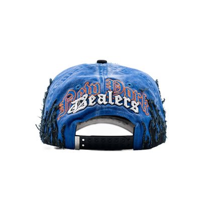 Blue distressed snapback hat with 'New York Dealers' embroidery and black flame details