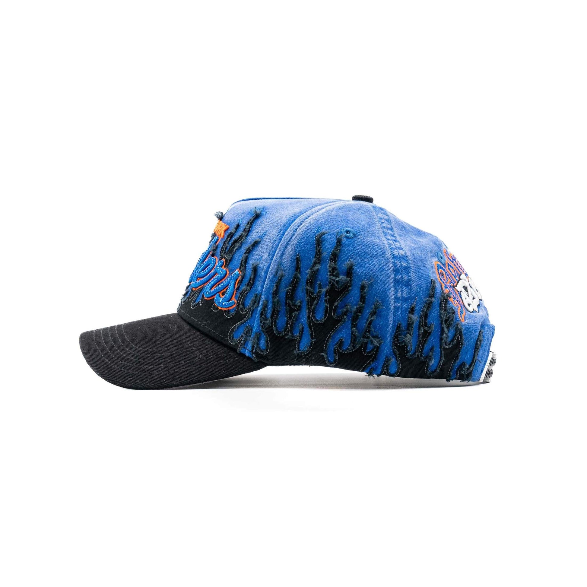 Blue and black flame-embroidered baseball cap with skull graphic and curved brim