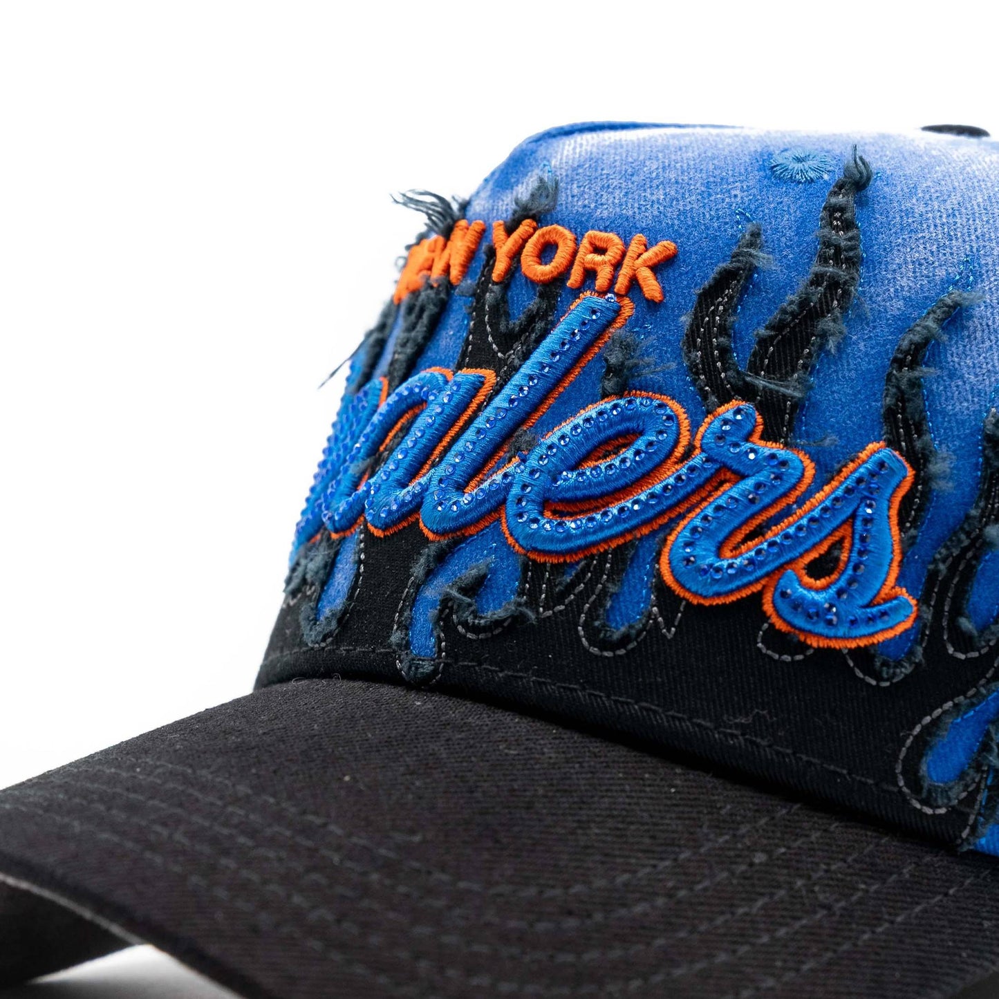 Distressed blue and black baseball cap with bold embroidered lettering and flame accents