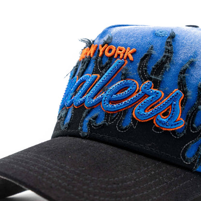 Distressed blue and black baseball cap with bold embroidered lettering and flame accents