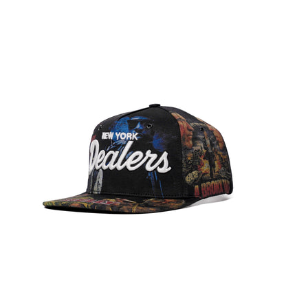 The Classics NY movie-collage snapback, flat brim — front three-quarter angle