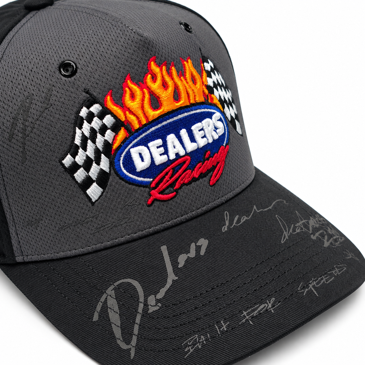 Dealers Racing Reflective snapback, angled close-up of the badge and signature marks on the brim