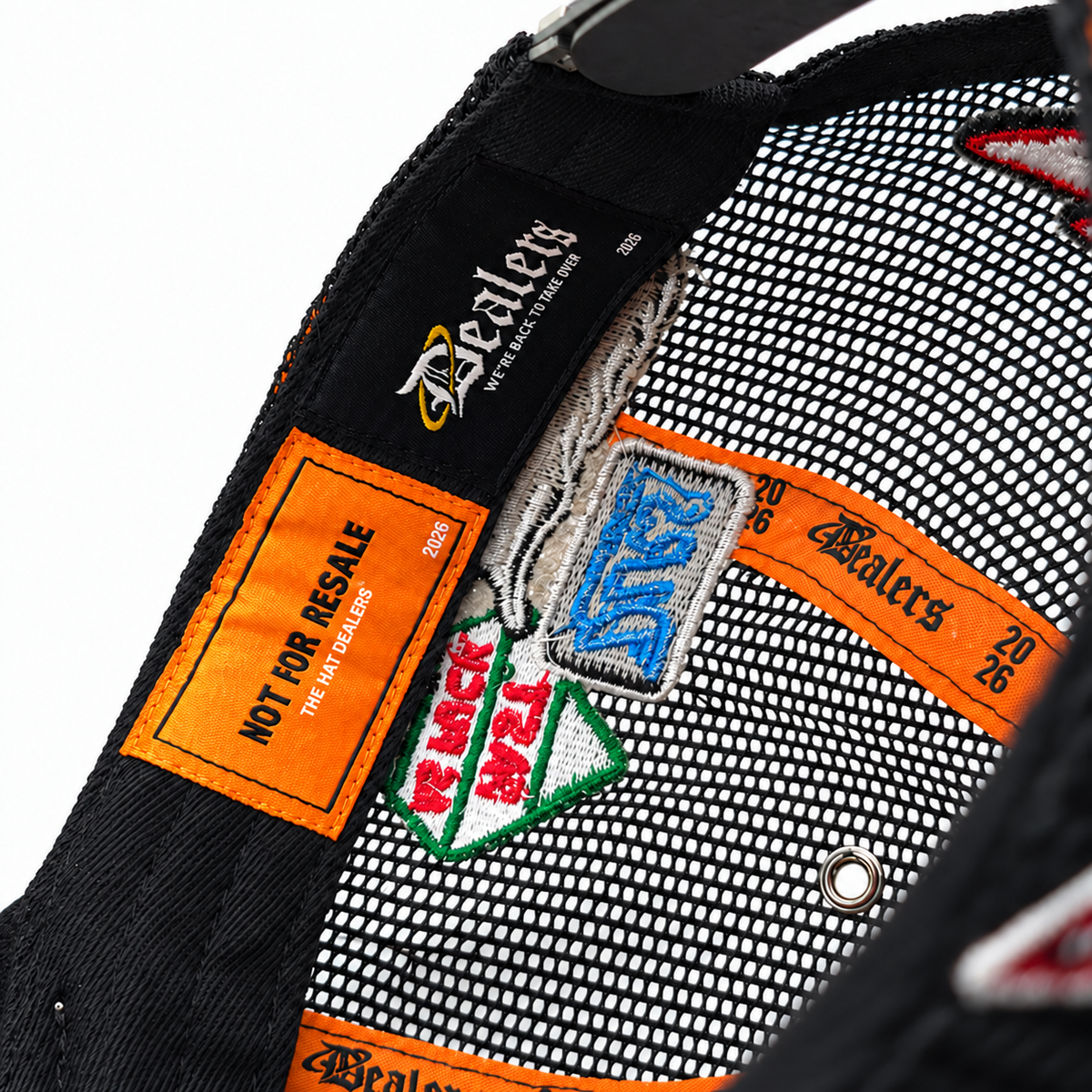 Inside the Fast Life Racing Trucker — NOT FOR RESALE and Dealers labels with orange Dealers 2026 taping