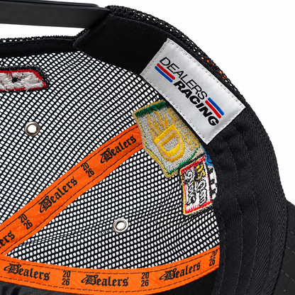 Inside the Fast Life Racing Trucker — DEALERS RACING woven label and orange printed taping