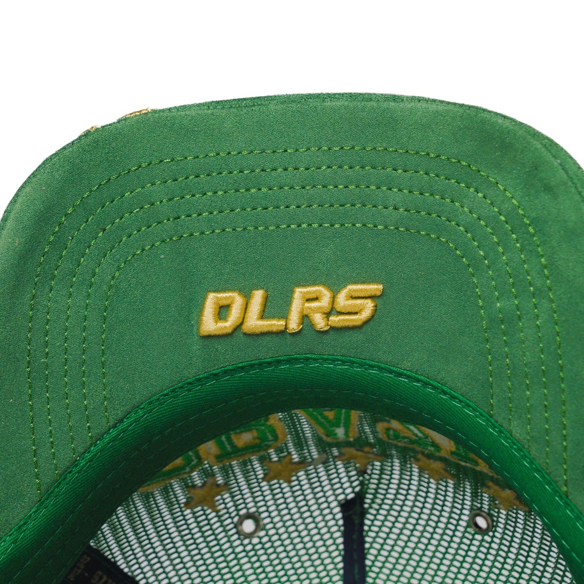 Underbrim detail of the Brazil trucker hat — The Hat Dealers — green underbrim with gold DLRS embroidery