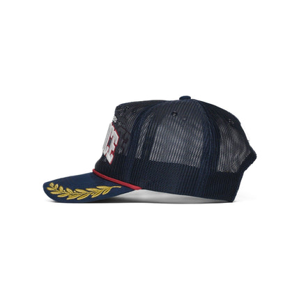 Left side of the France trucker hat — The Hat Dealers — navy mesh with a multicolor side patch and gold laurel brim