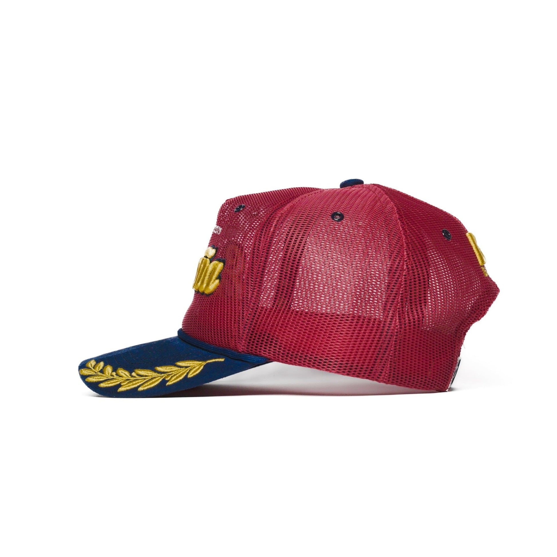 Left side profile of Spain trucker hat — The Hat Dealers — red mesh back and navy gold-laurel flat brim