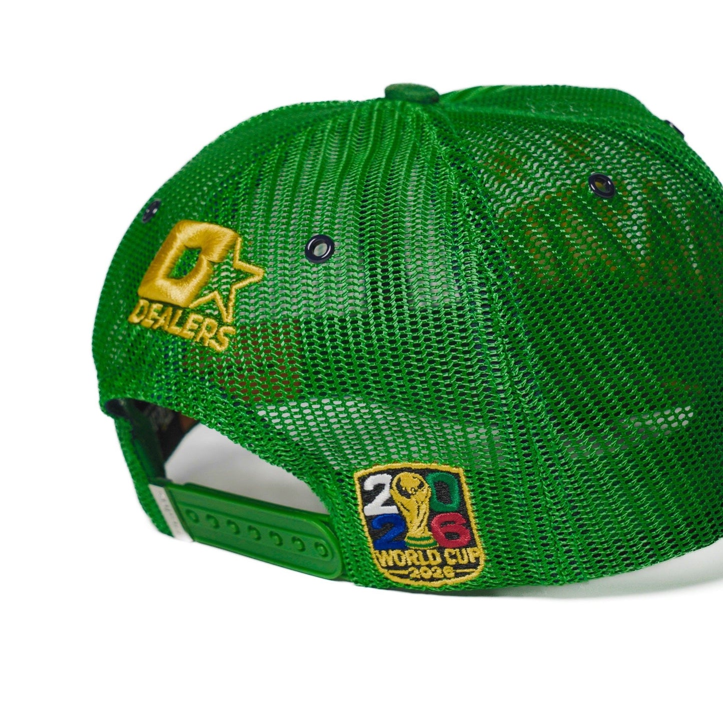 Back detail of the Brazil trucker hat — The Hat Dealers — close-up of gold Dealers embroidery and woven patch