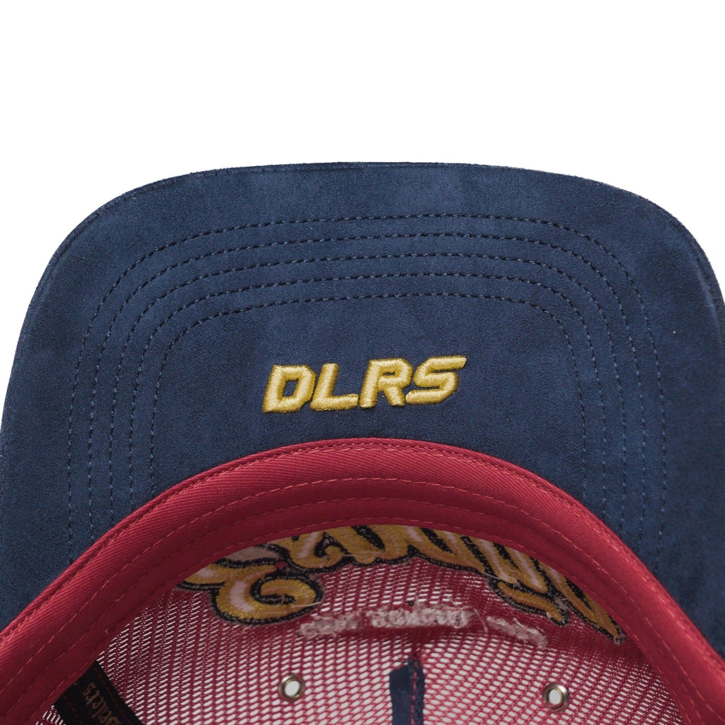 Underbrim detail of Spain trucker hat — The Hat Dealers — navy underside with gold DLRS embroidery