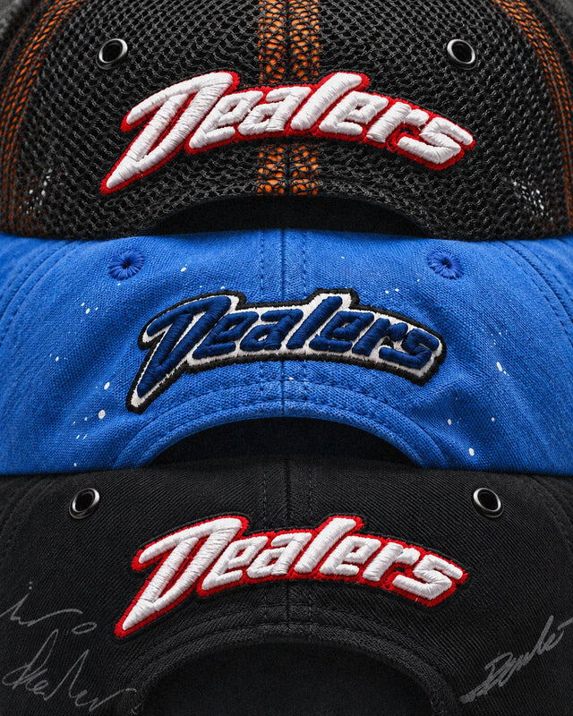 Close-up of the Dealers script embroidery on all three hats